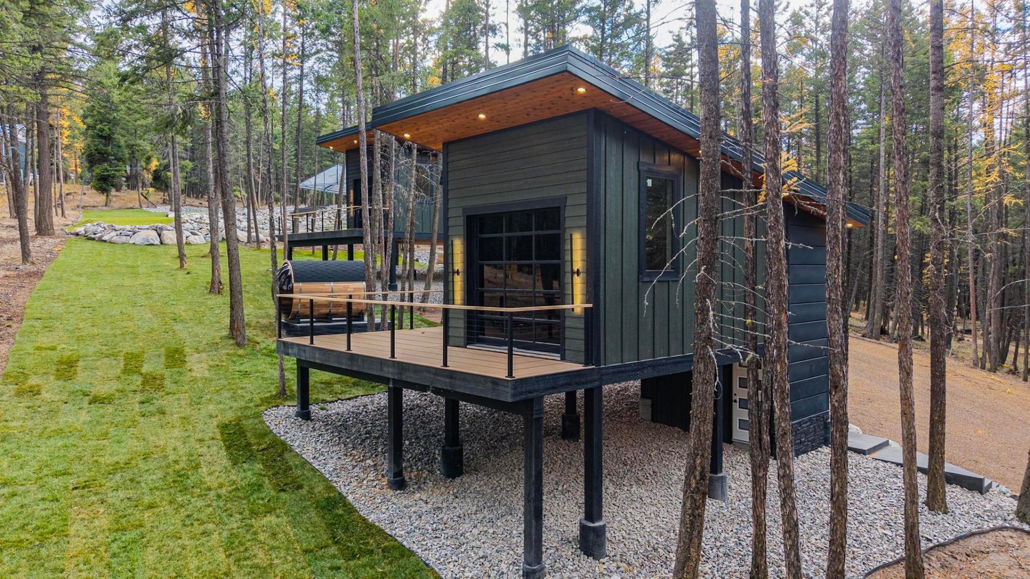 Aerial view of The Ridge treehouse cabin and its deck among the trees