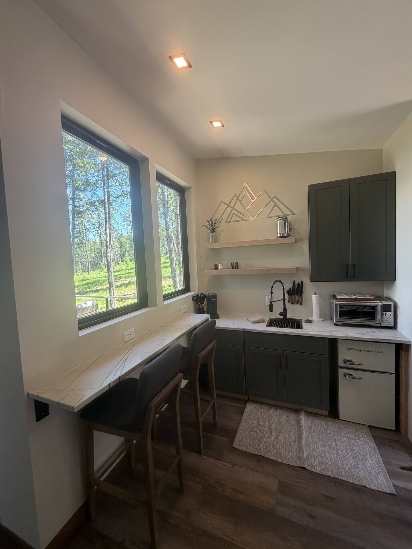 Fully stocked kitchenette at The Ridge with quartzite countertops