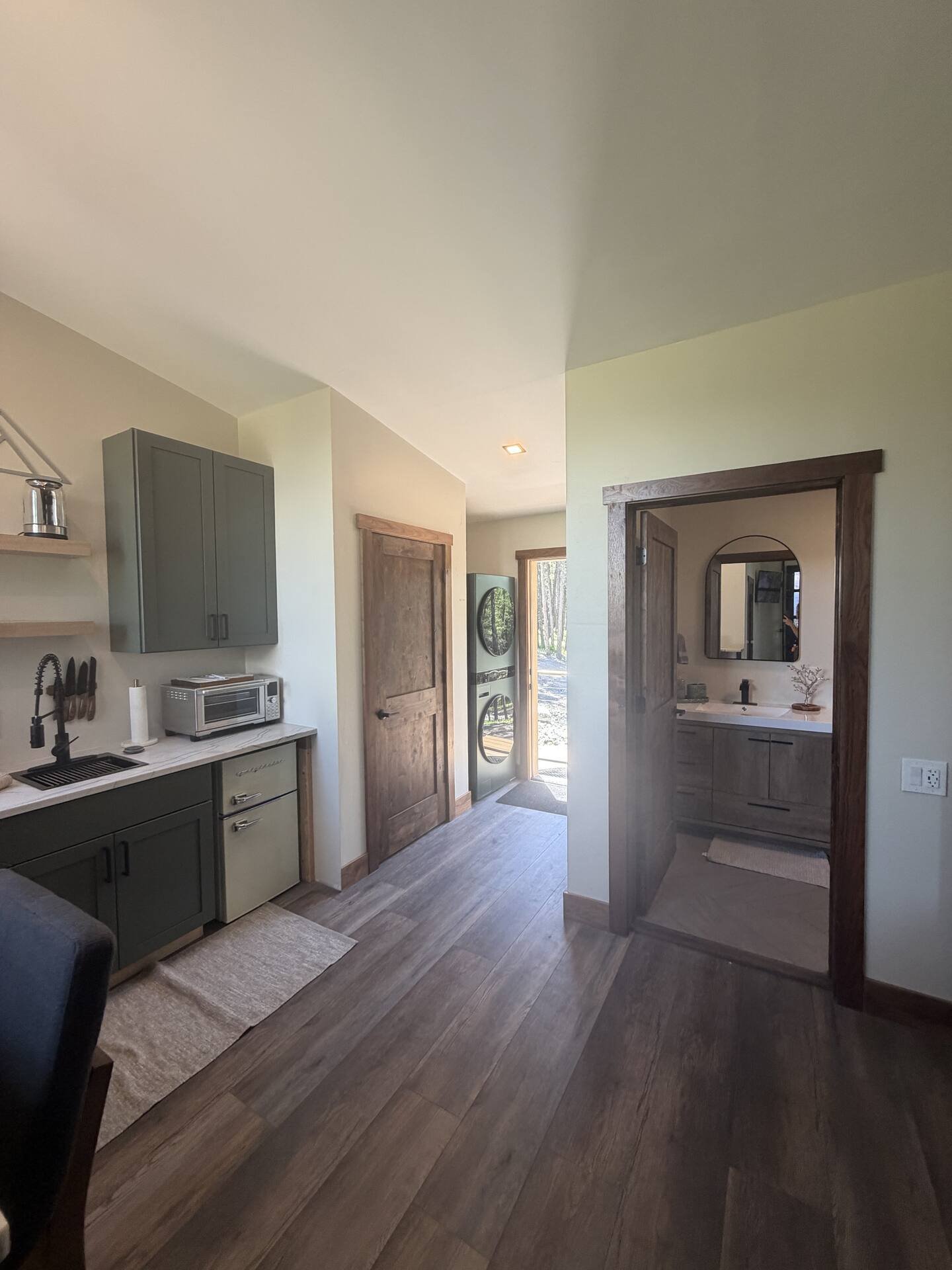Living area at The Ridge with pull-out couch and treetop views
