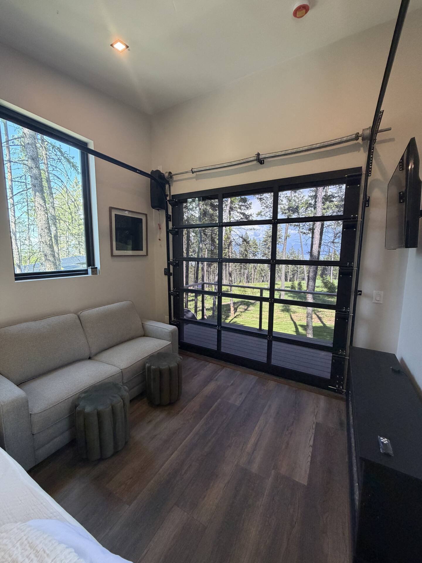 Living area at The Summit with pull-out couch and forest outlook